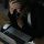 stressed woman with head in hands at laptop